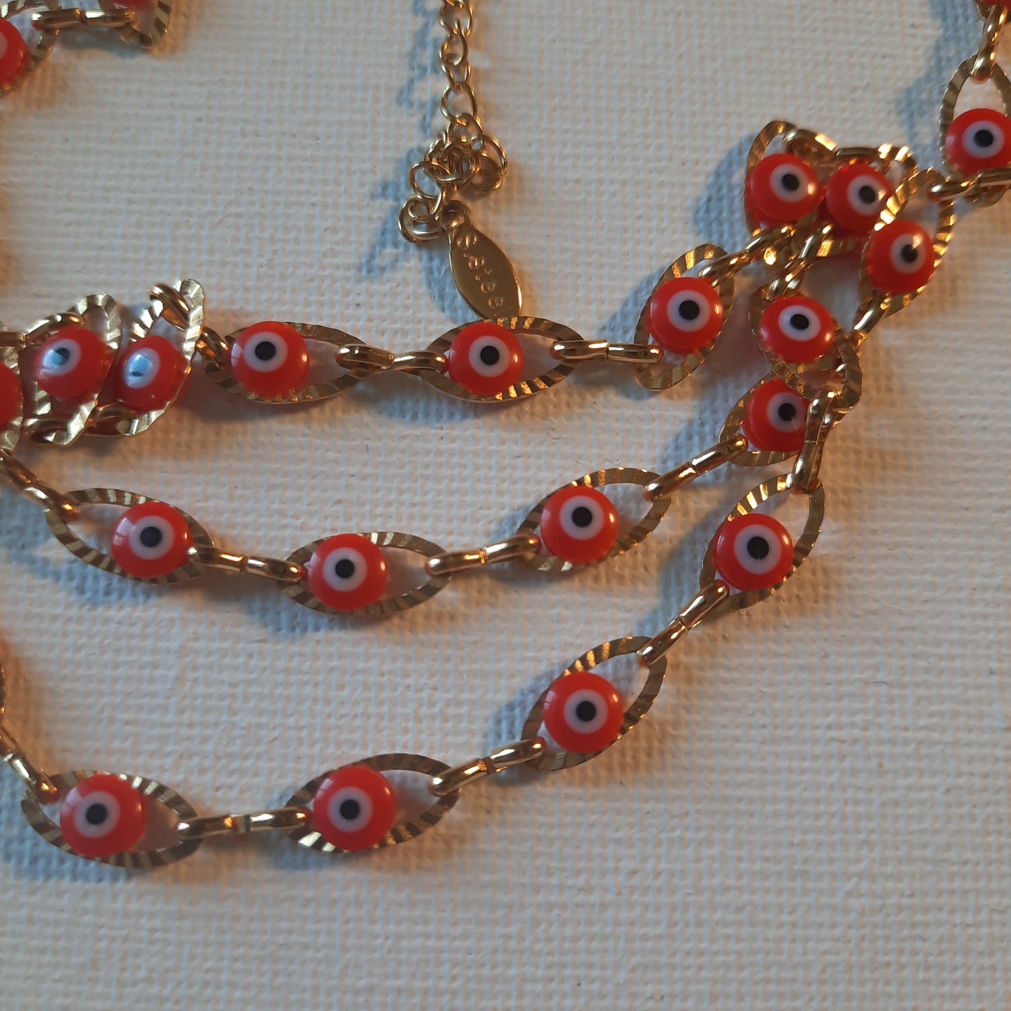 Collier chaîne dorée acier inoxydable stainless steel et perles evil eye, œil de Turquie rouge ajustable réglable