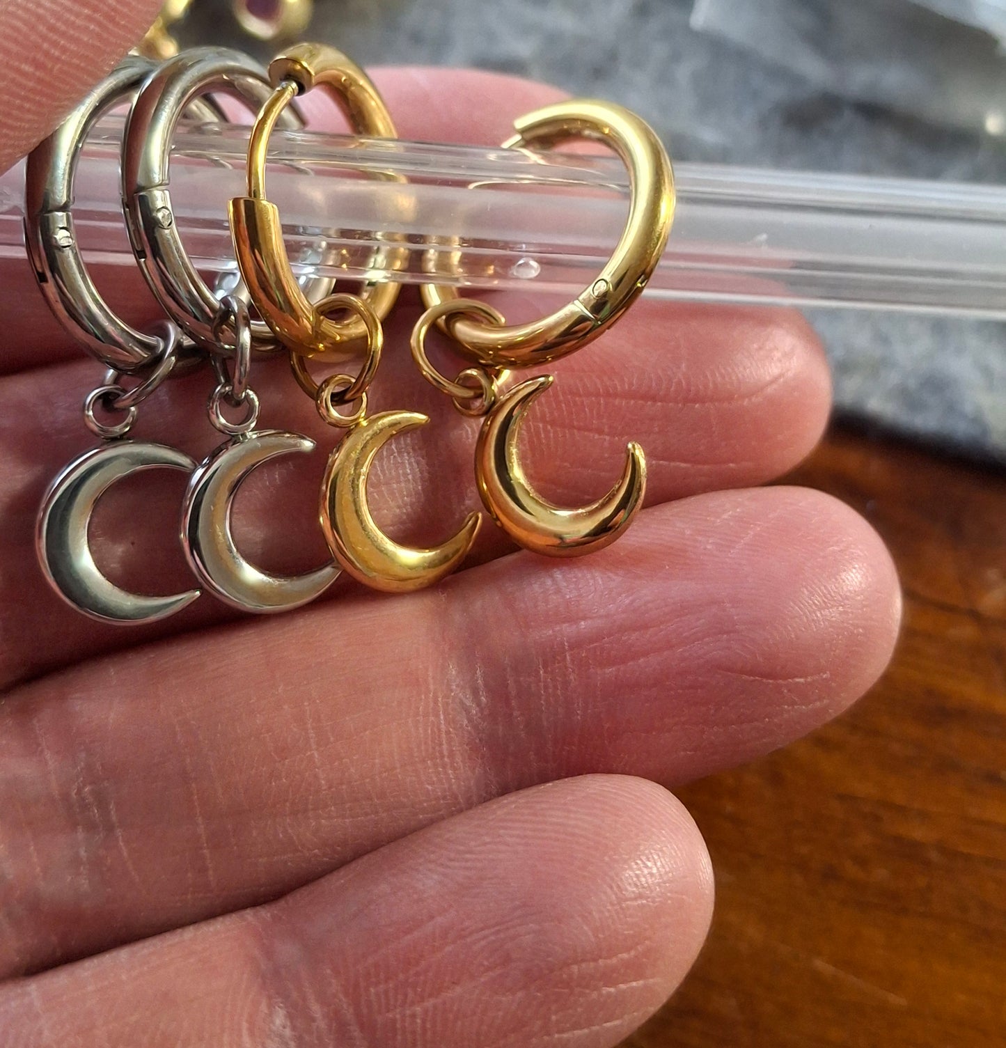 Stainless steel 316 single hoop earrings with moon pendant, sold as a pair