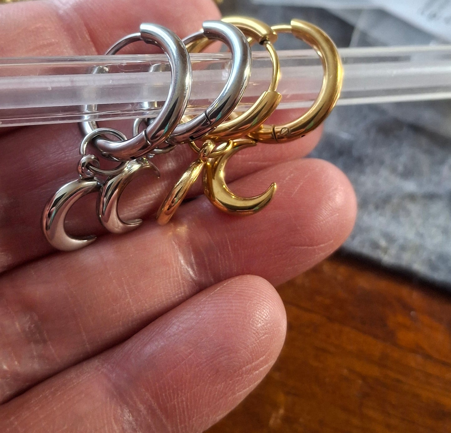 Stainless steel 316 single hoop earrings with moon pendant, sold as a pair