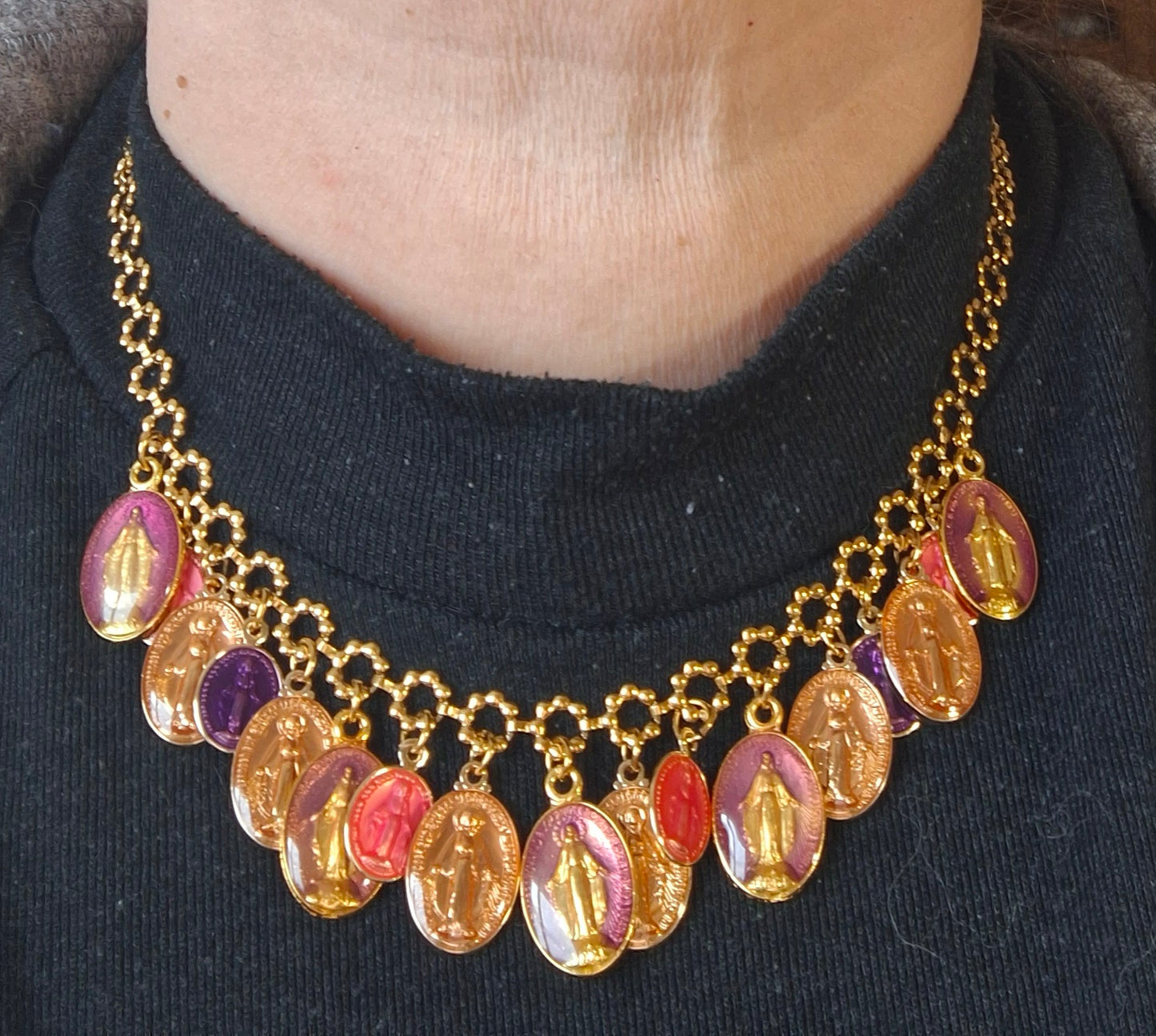 Adjustable gold-tone stainless steel chain necklace with flower motif and Madonna charms