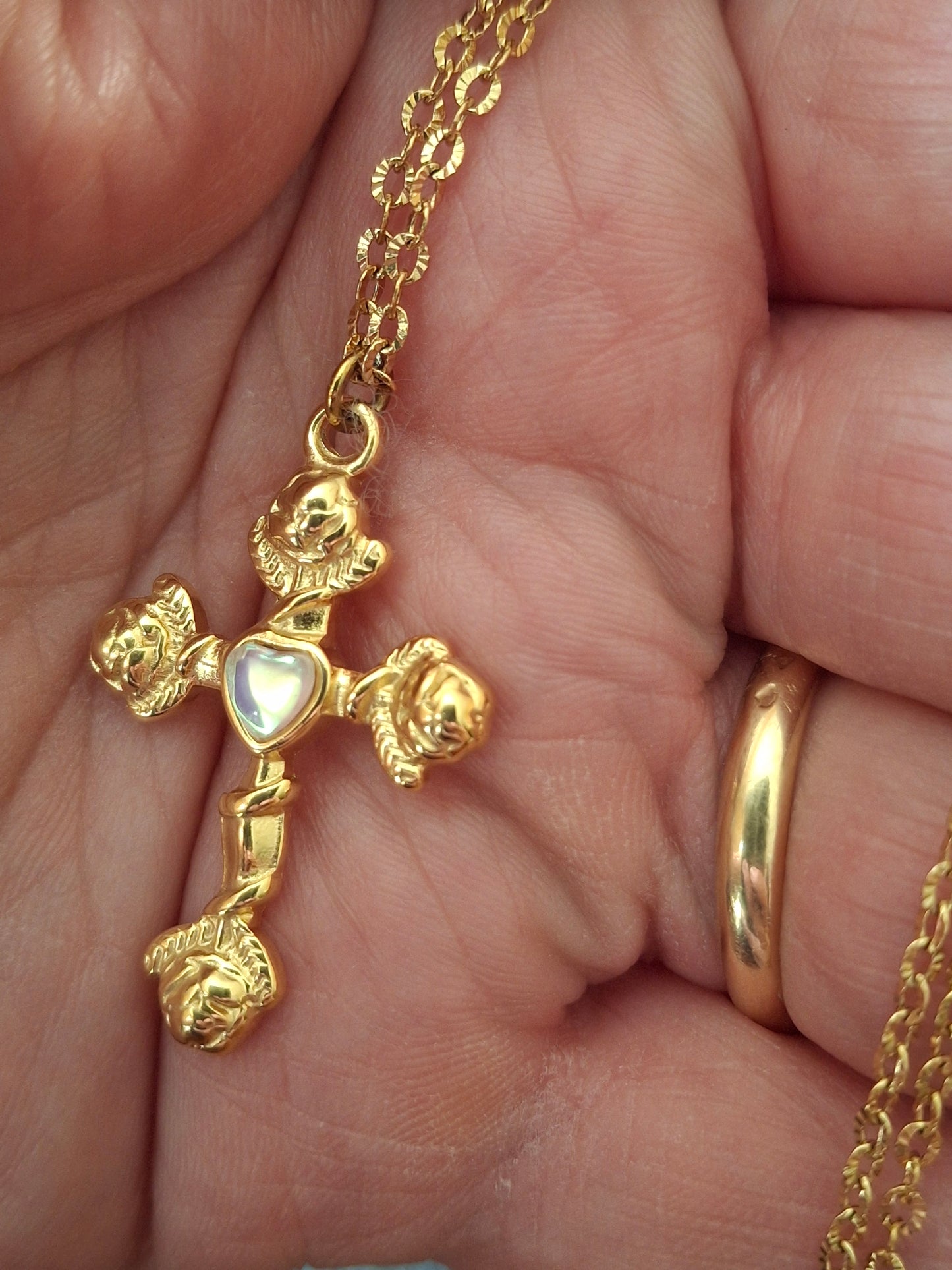 Gold chain necklace made of 316 stainless steel and polished 316 stainless steel cross.
