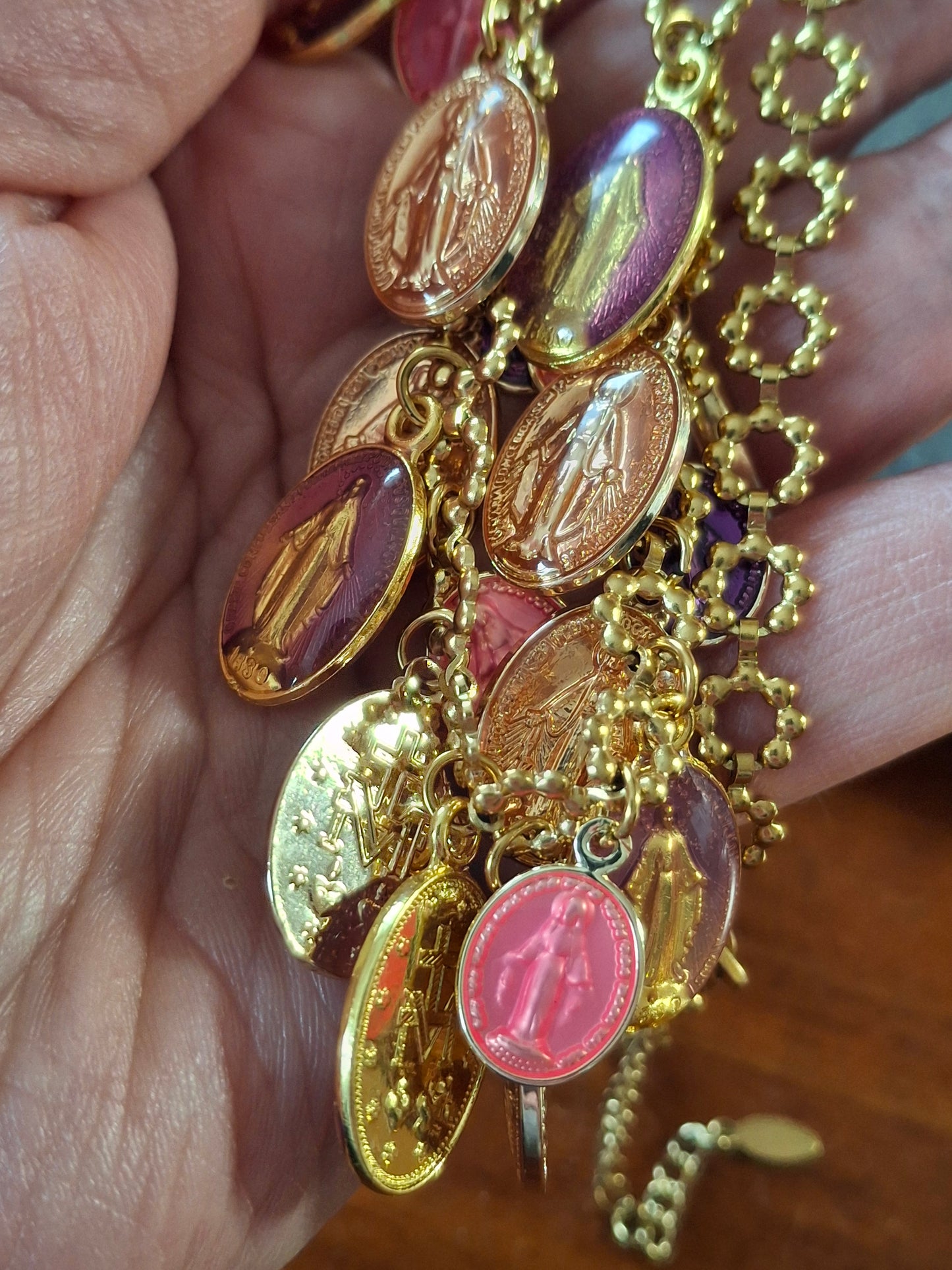 Adjustable gold-tone stainless steel chain necklace with flower motif and Madonna charms