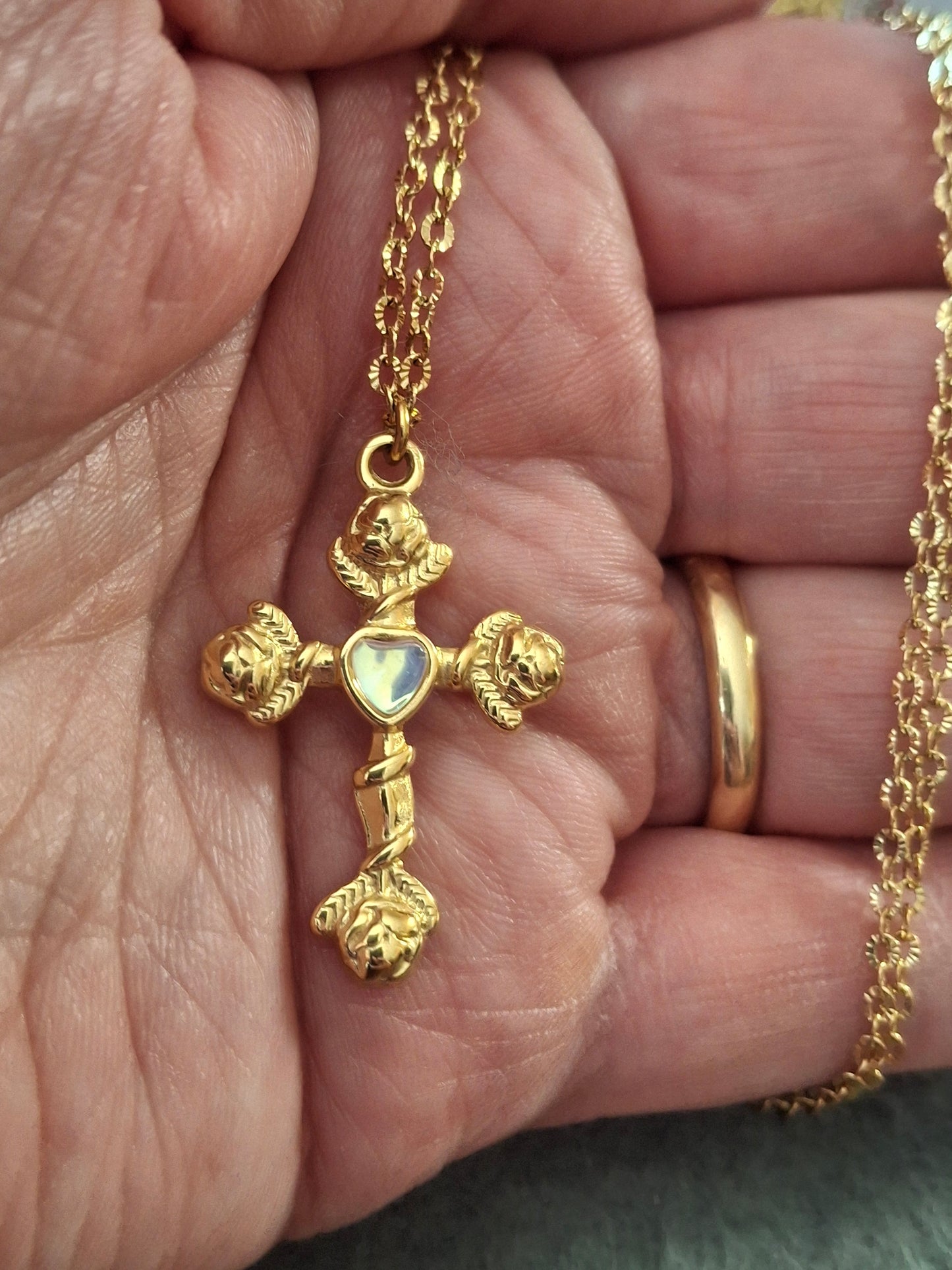 Gold chain necklace made of 316 stainless steel and polished 316 stainless steel cross.