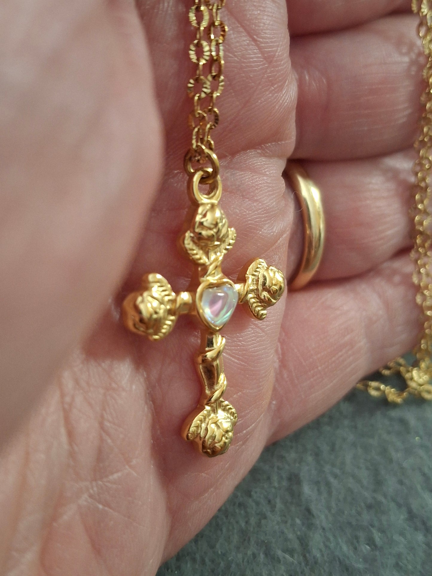 Gold chain necklace made of 316 stainless steel and polished 316 stainless steel cross.