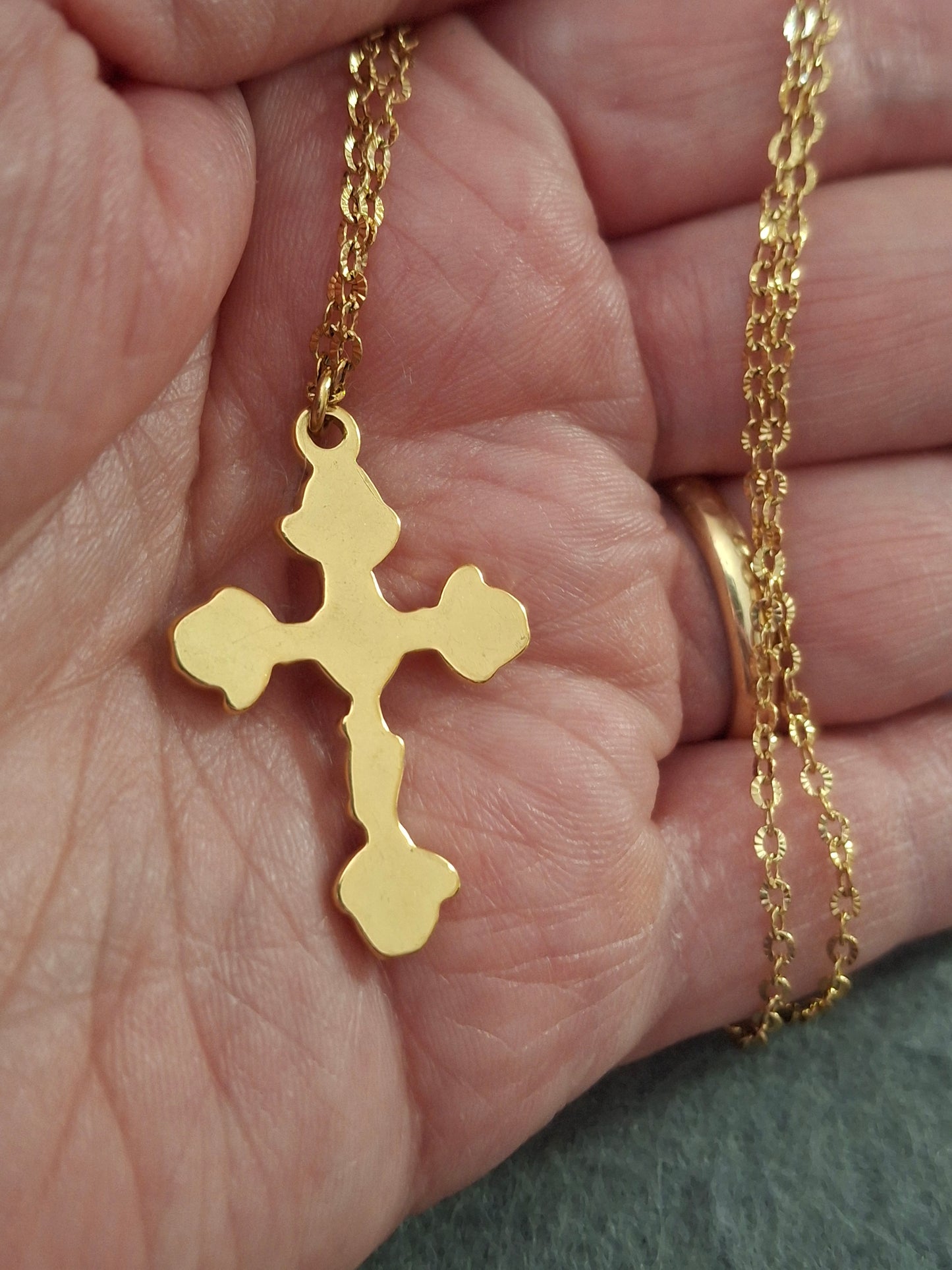 Gold chain necklace made of 316 stainless steel and polished 316 stainless steel cross.