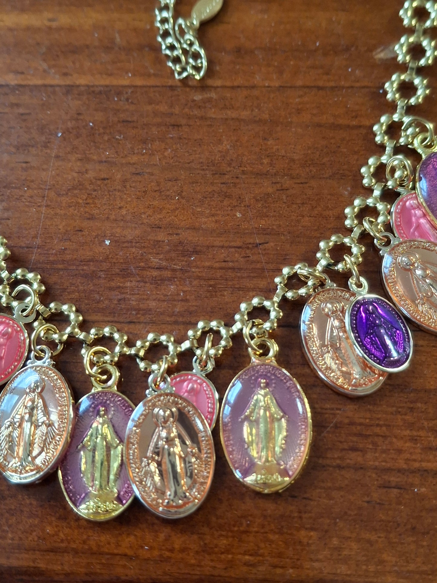 Adjustable gold-tone stainless steel chain necklace with flower motif and Madonna charms