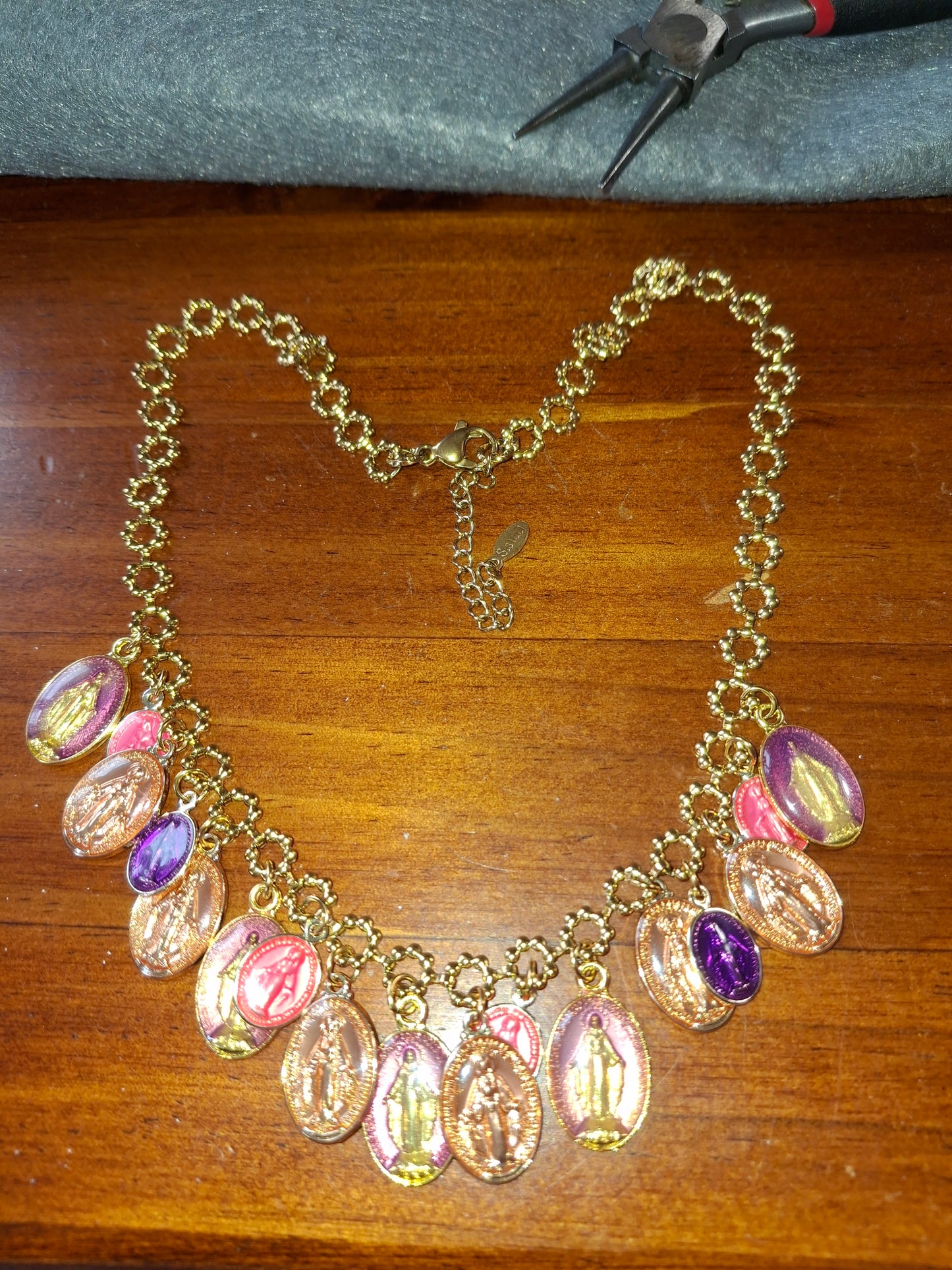 Adjustable gold-tone stainless steel chain necklace with flower motif and Madonna charms