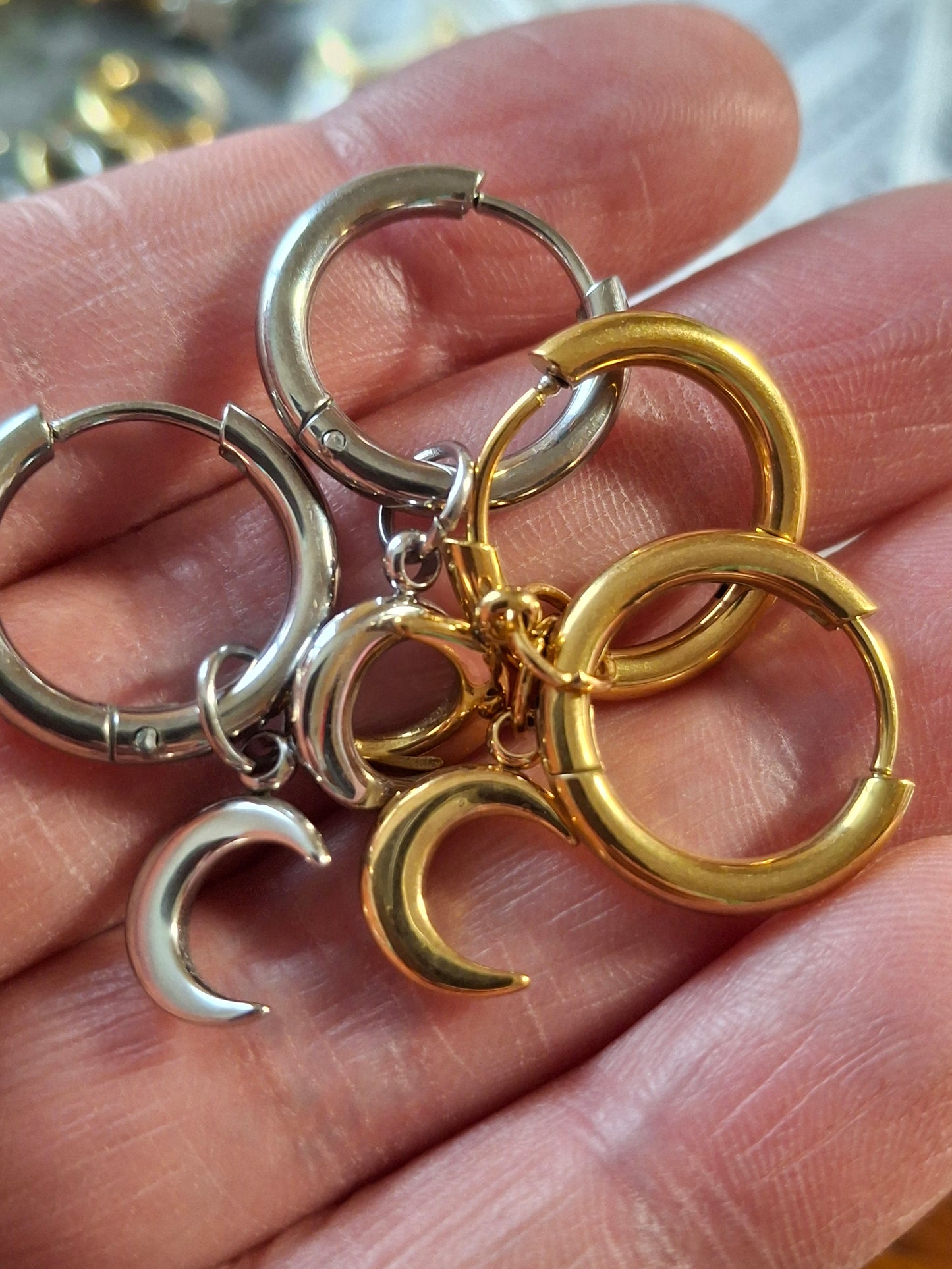 Stainless steel 316 single hoop earrings with moon pendant, sold as a pair