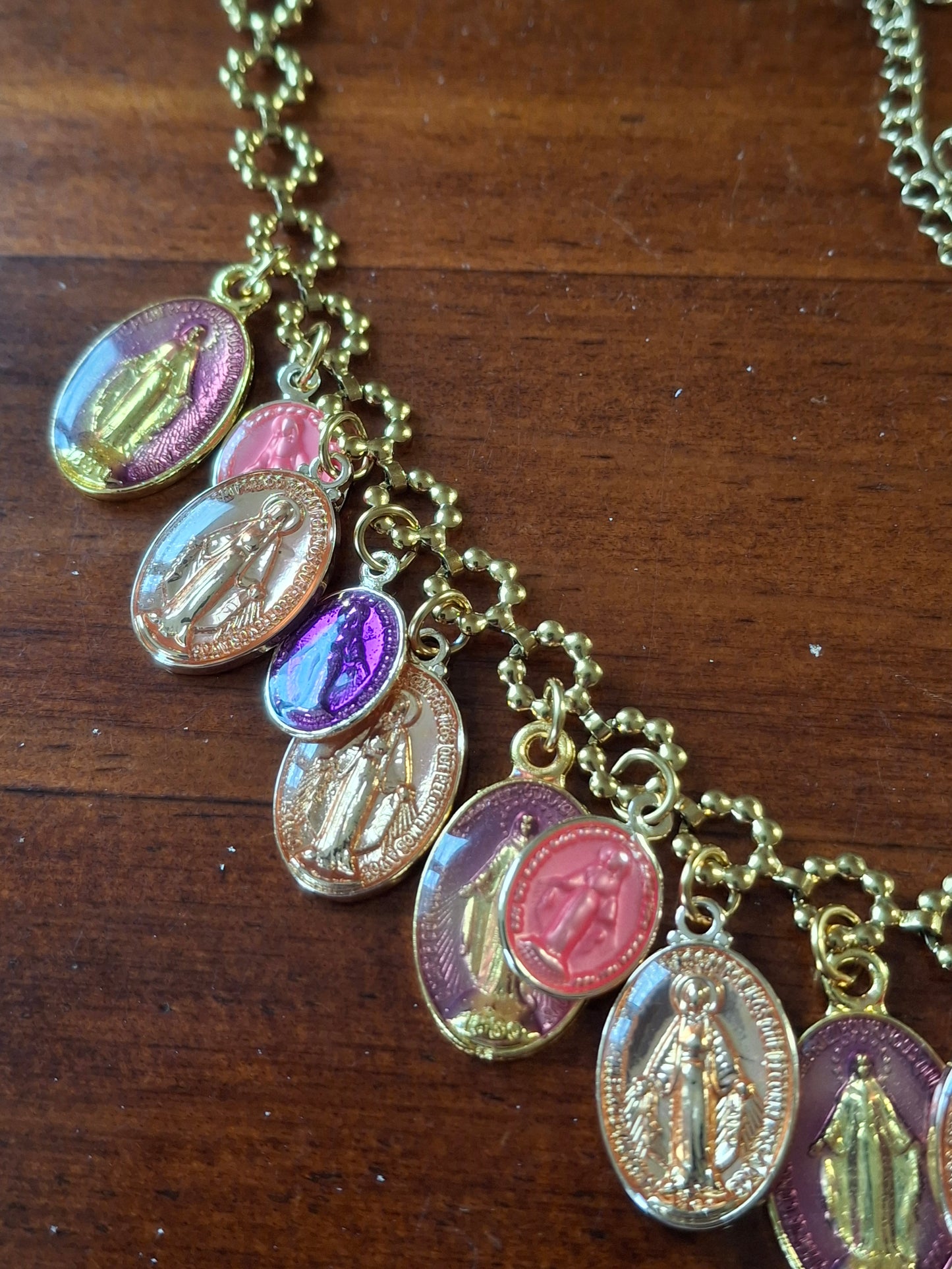 Adjustable gold-tone stainless steel chain necklace with flower motif and Madonna charms