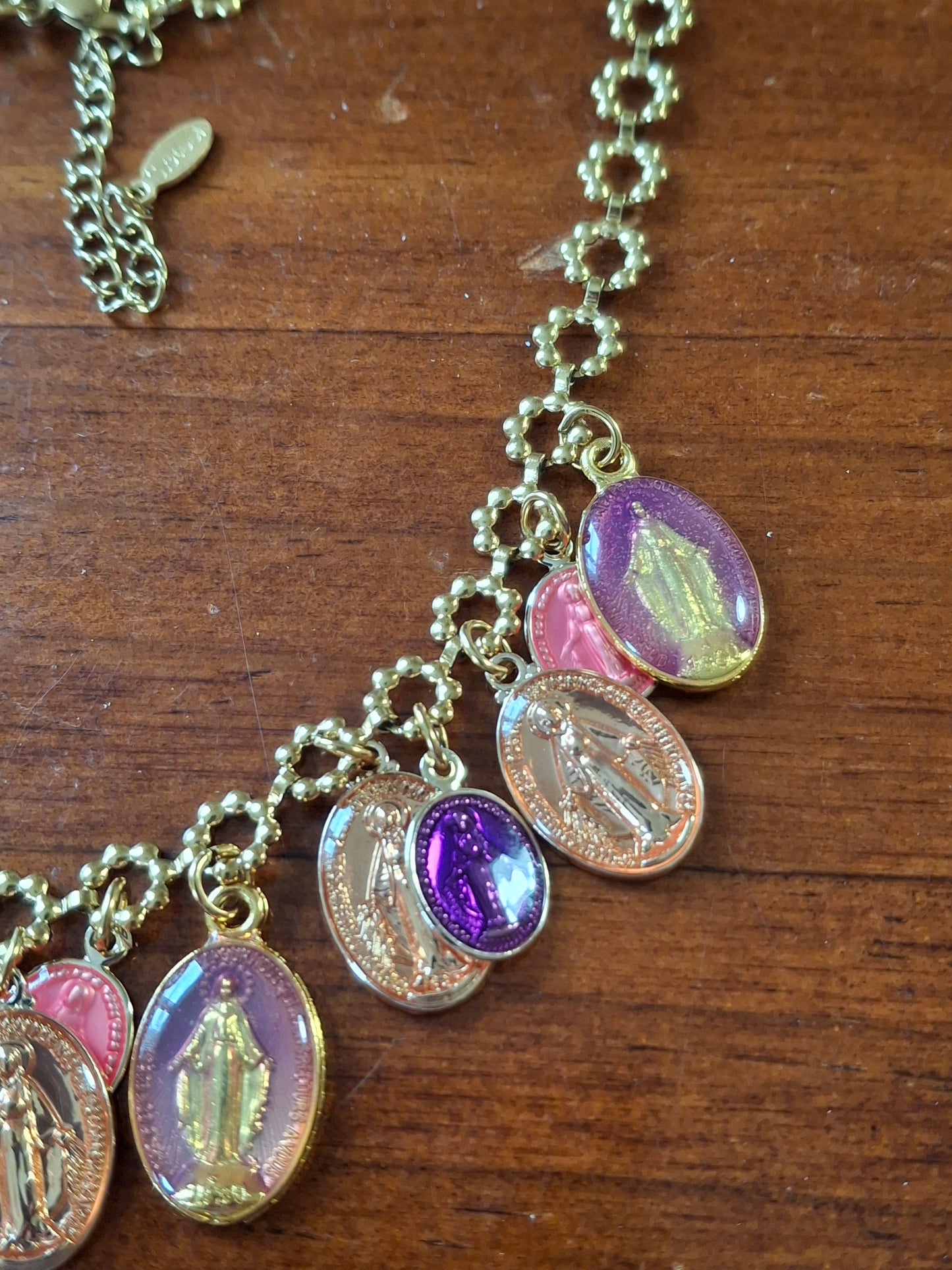 Adjustable gold-tone stainless steel chain necklace with flower motif and Madonna charms