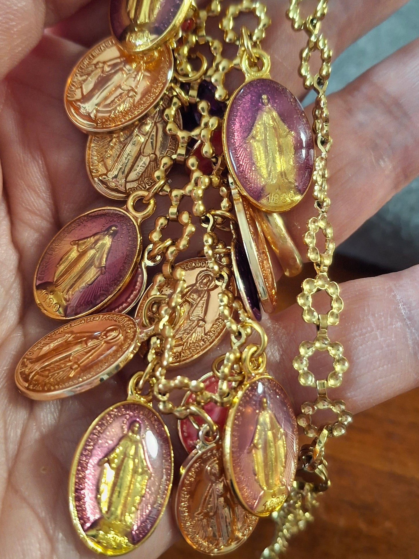 Adjustable gold-tone stainless steel chain necklace with flower motif and Madonna charms